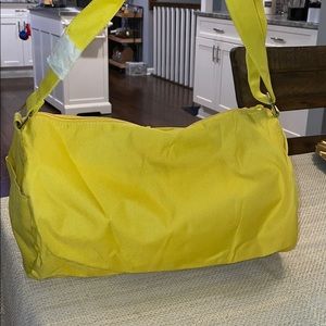 Yellow overnight bag, makeup bag, gym bag,